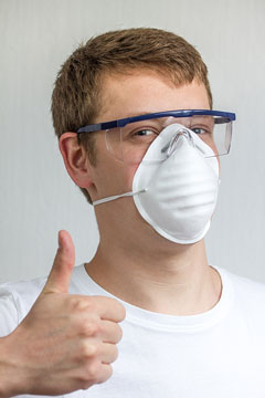 man wearing a dust mask and safety glasses