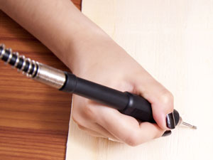 holding a power engraving tool